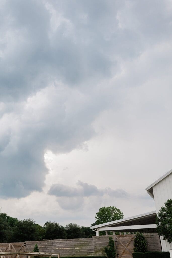 Shot of the sky and the rainy cloudy weather on Danielle and Aaron's wedding day at The Farmhouse