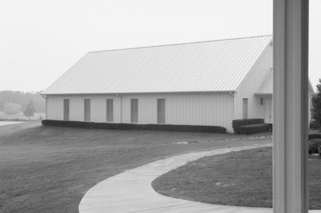Black and white image of the rain on a wedding day at The Farmhouse