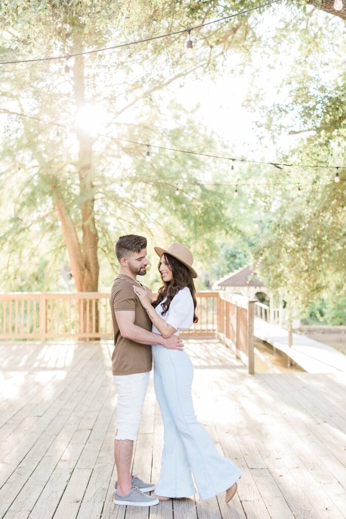 bride and groom practicing their first dance on the deck at the orchard at caney creek 