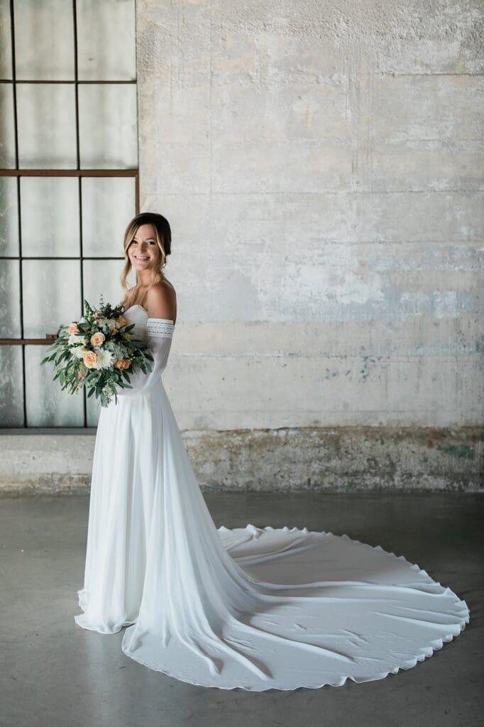 Bride posing in chapel for bridal portraits at Olde Dobbin Station