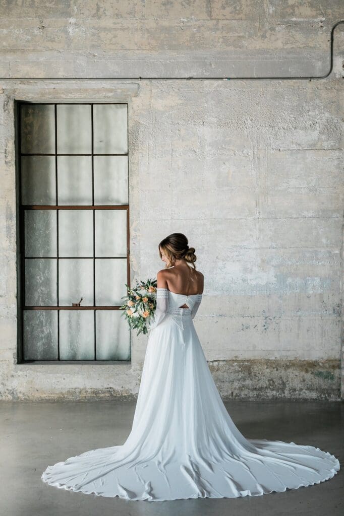 Back of the brides dress and train for her bridal portraits at Olde Dobbin Station