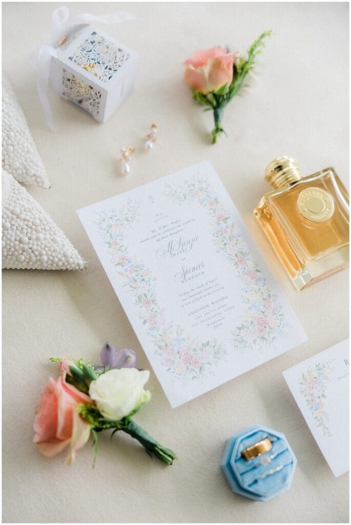 Flatlay details of a spring inspired wedding invitation
