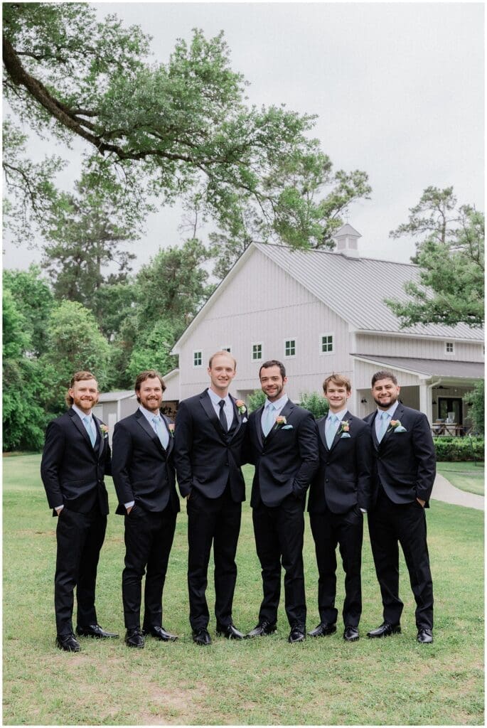 Groom and groomsmen portraits outdoors at Addison Woods