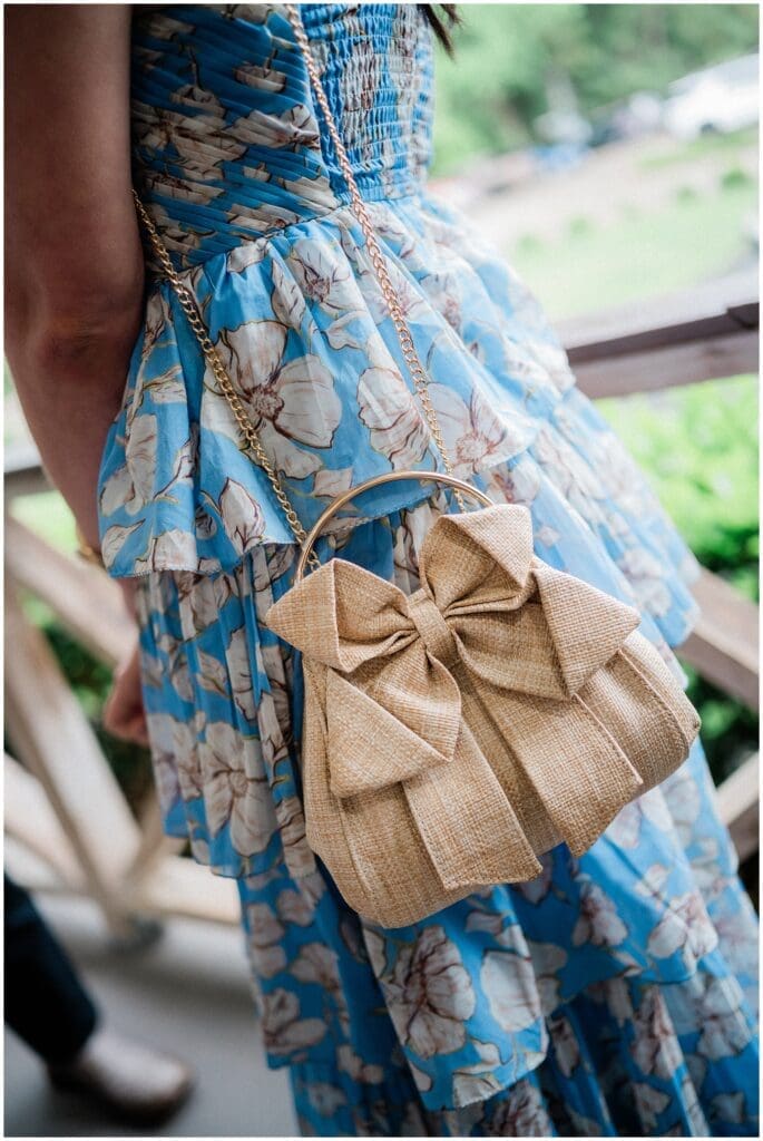 Stylish gold bag with a bow during cocktail hour at Addison Woods