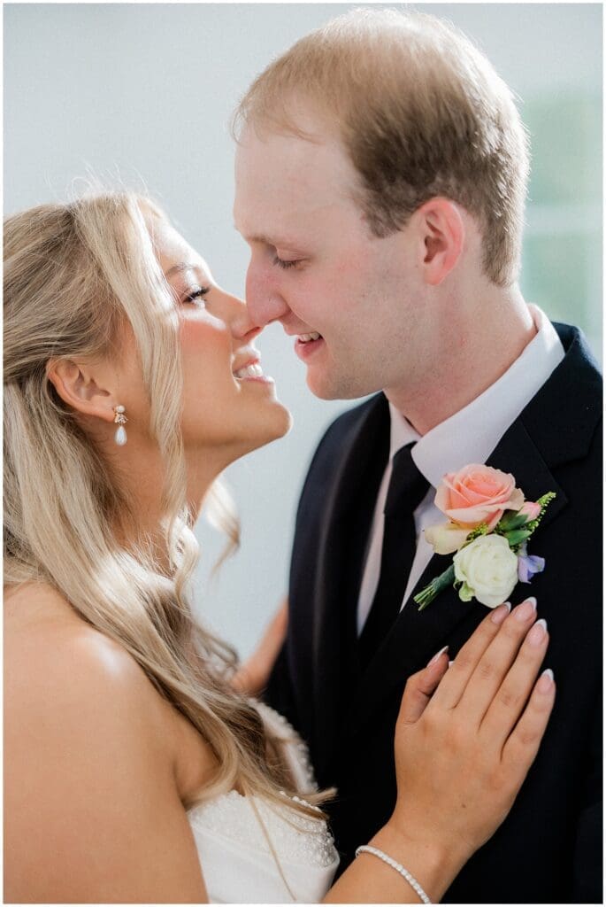 Bride and groom going in for a kiss at Addison Woods