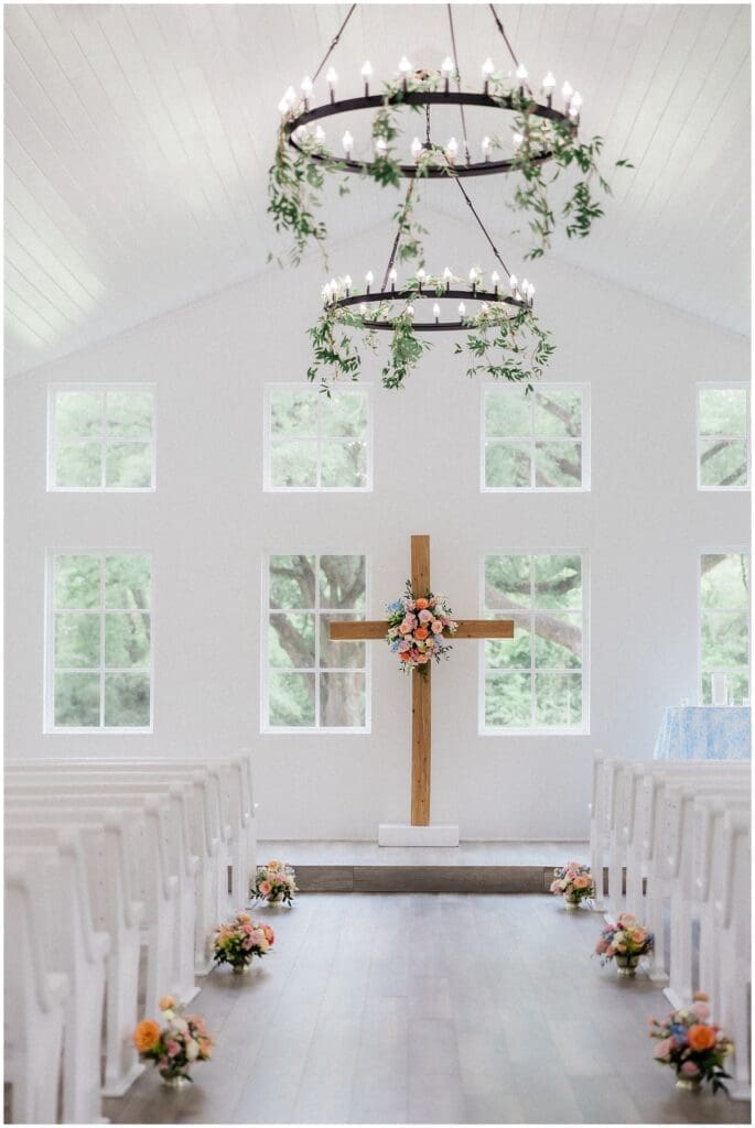 Decorated cross with florals in the chapel at Addison Woods