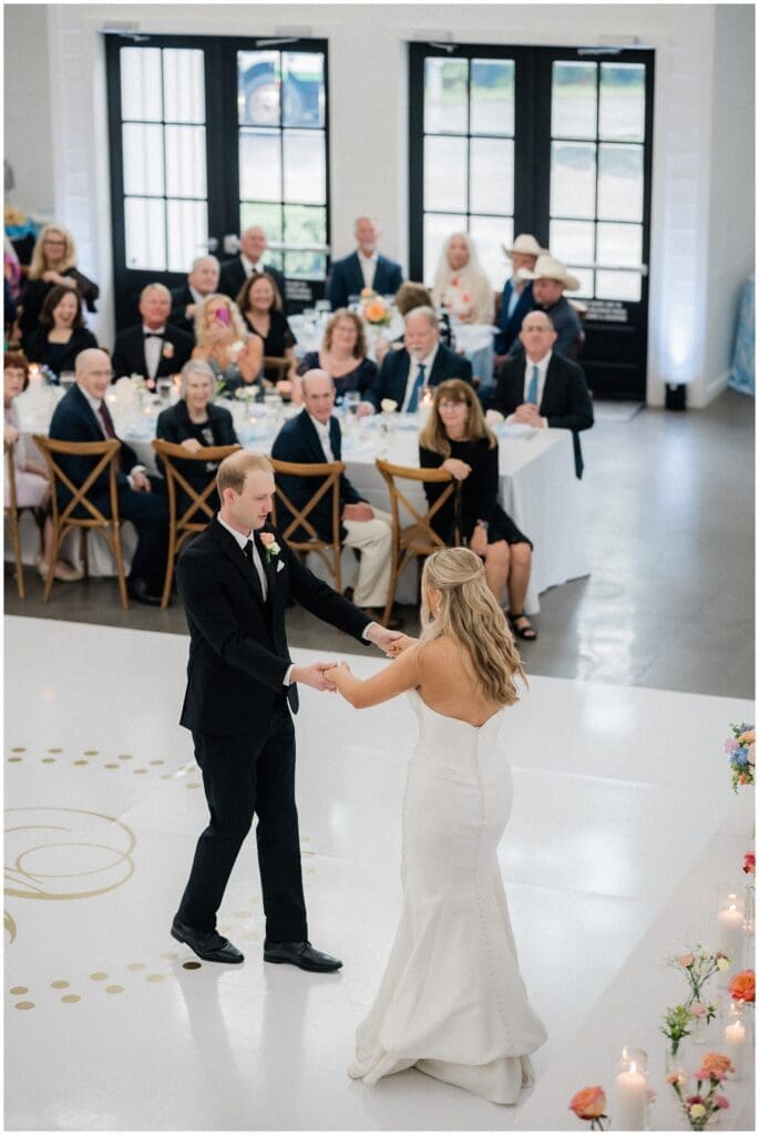Bride and groom sharing their first dance as a married couple at Addison Woods