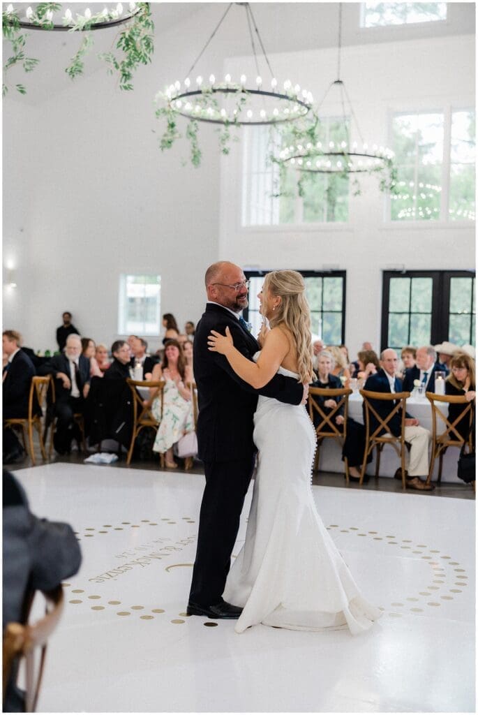 Bride sharing first dance with her father at Addison Woods