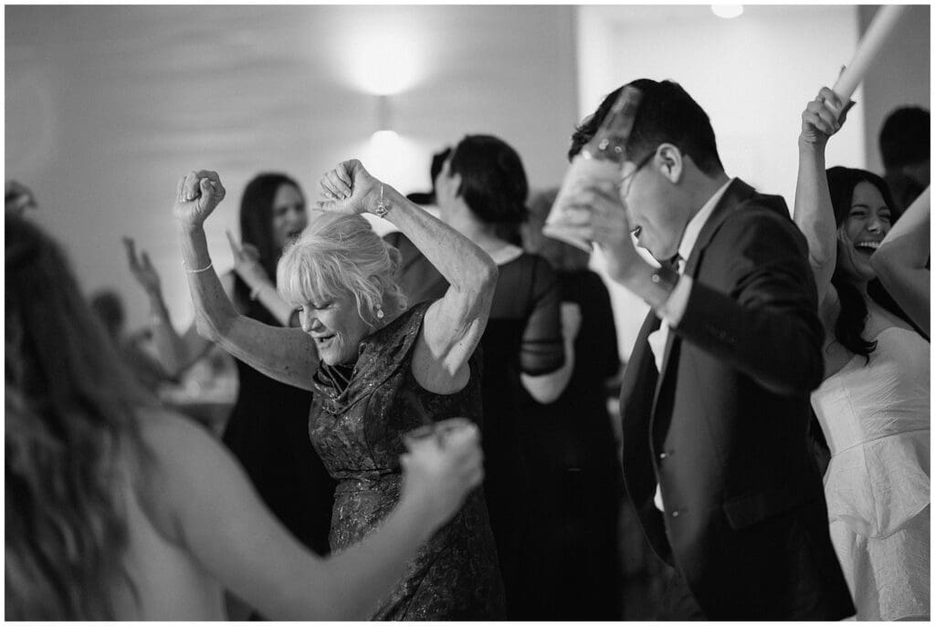 Mother of the bride dancing the night away at Addison Woods