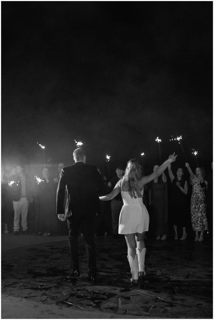 Bride and groom sparkler exit at Addison Woods