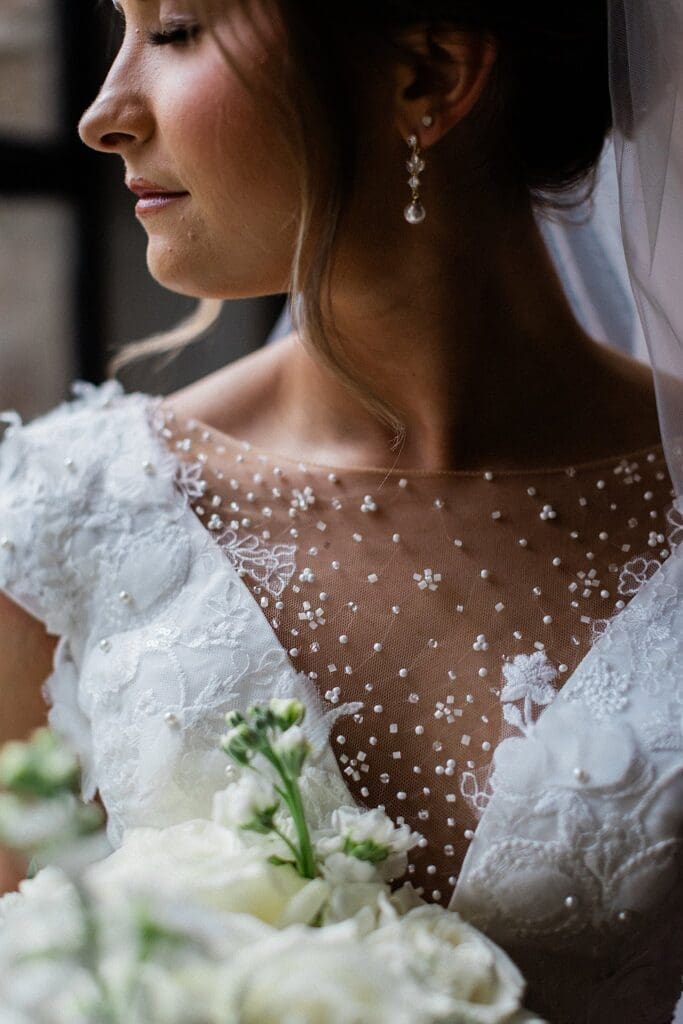 Close up of brides beaded wedding dress at Iron Manor