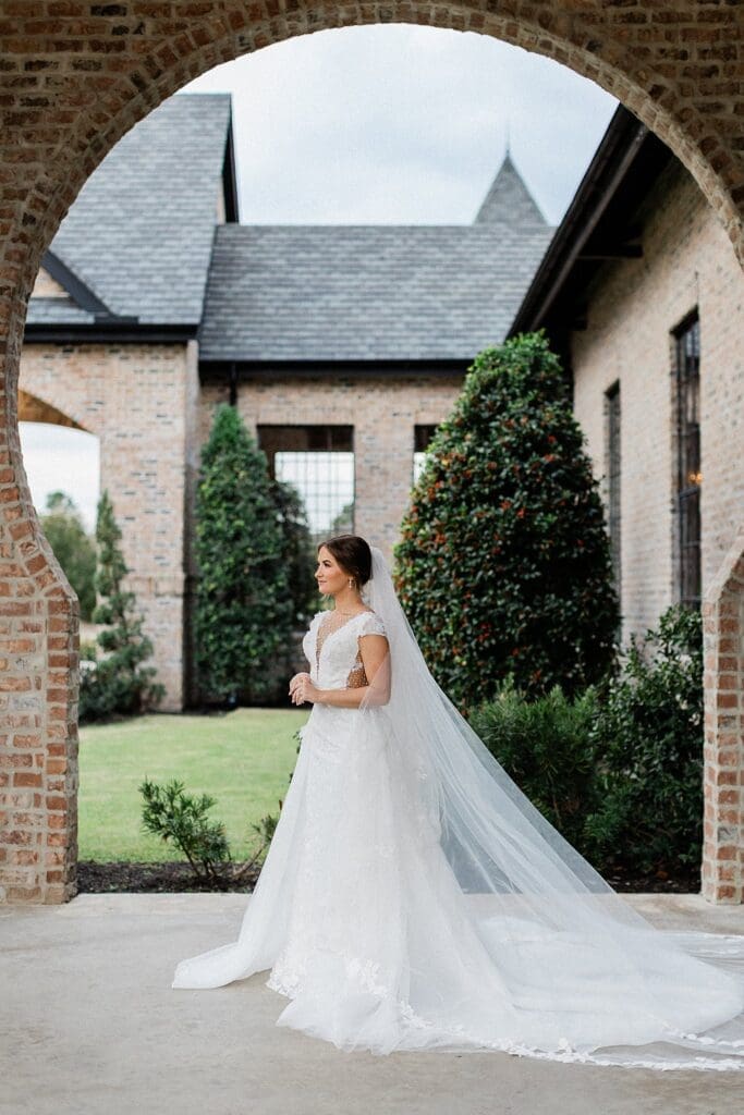 Bride posing for bridal portraits at Iron Manor