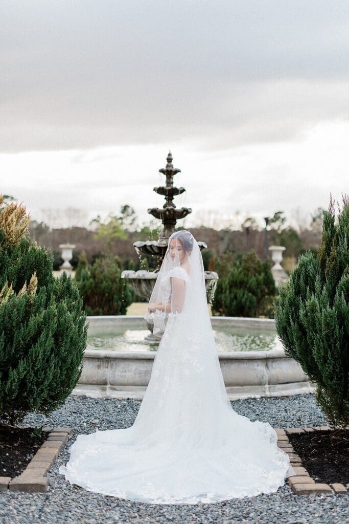 Veil draped over bride during her bridals at Iron Manor