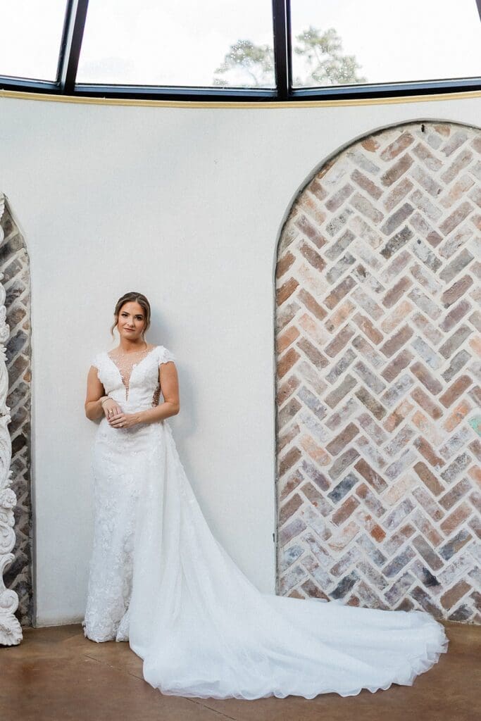 Bride smiling for the camera in the bridal suite at Iron Manor
