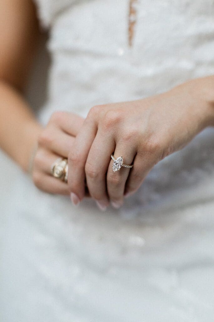 Close up of bride's diamond wedding ring at Iron Manor